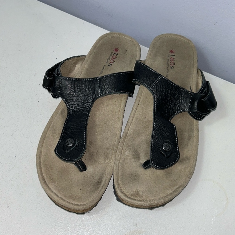 Taos Footwear Black Leather T-Strap Sandals with Tan Footbed